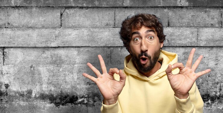 Free Photo feeling shocked amazed and surprised showing approval making okay sign with both hands