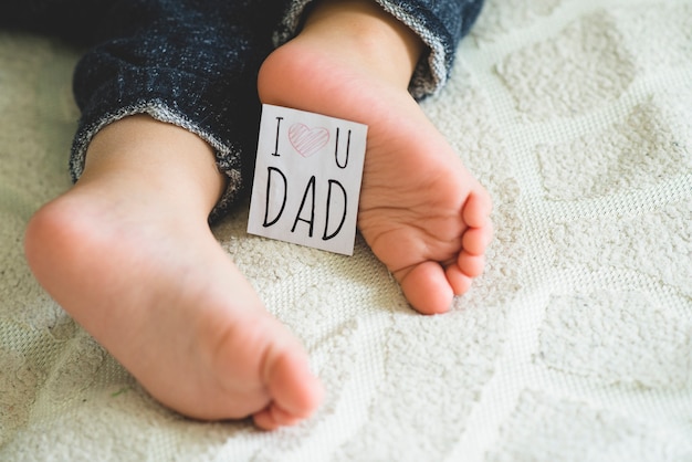 Feet with note for father's day