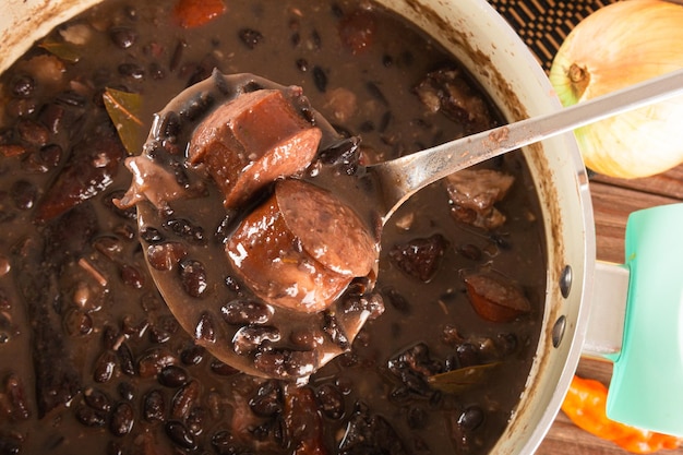 Feijoada typical brazilian food. traditional brazilian food made with black beans. Premium Photo