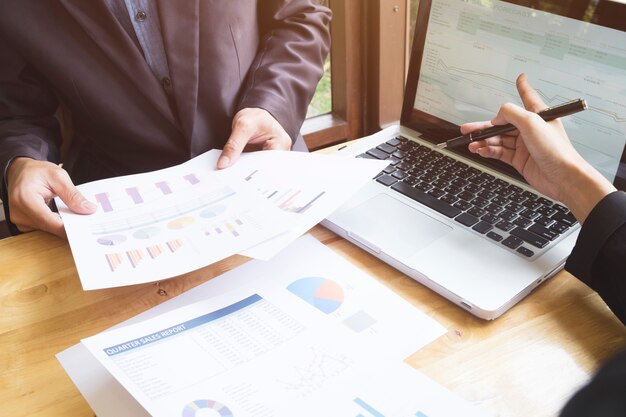 female analyzing finance cooperation tech touchpad