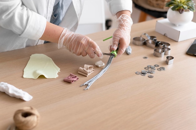 Female artisan working in the atelier with clay