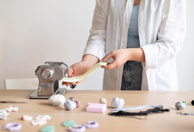 Female artisan working in the atelier with clay