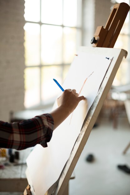 Female artist painting indoors