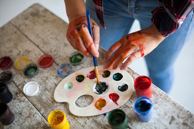 Female artist painting indoors