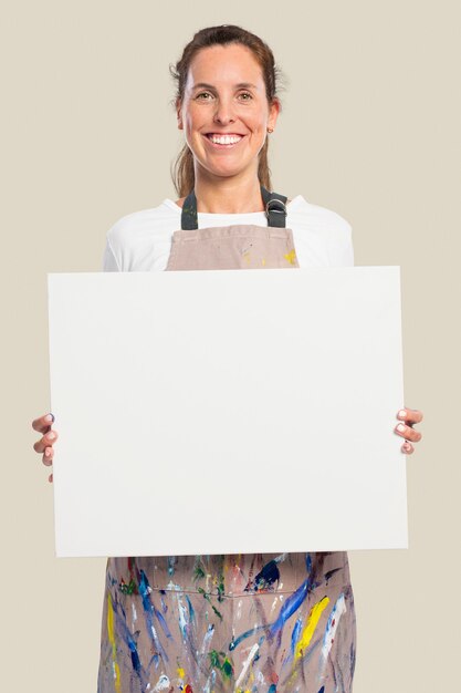 Female artist showing a white canvas with design space