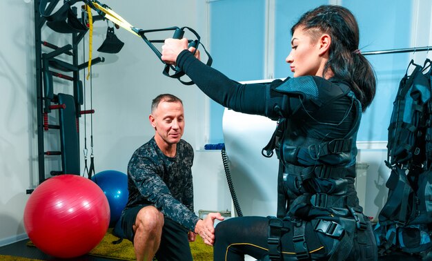 Female athlete doing exercises in a fitness studio