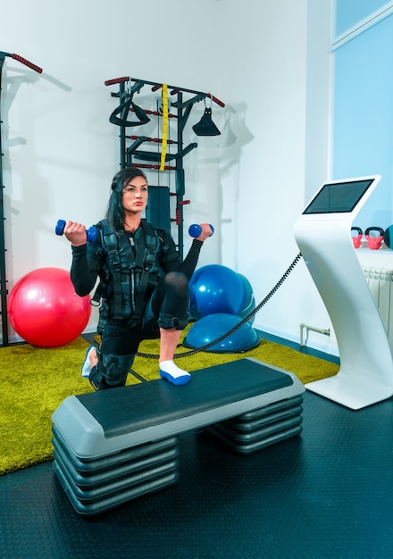 The female athlete doing they exercise in a ems fitness studio