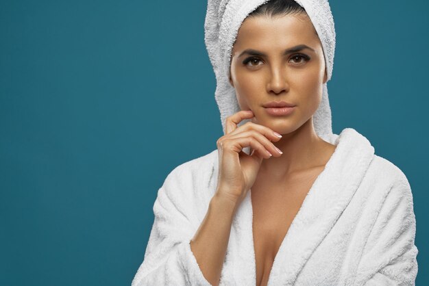 Female in bathrobe and towel posing