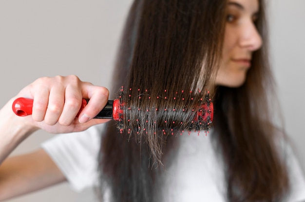 female brushing hair