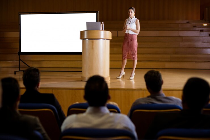 Free Photo female business executive giving presentation