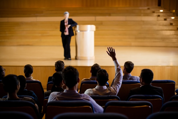 Female business executive giving a speech