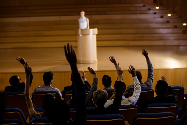 Free photo female business executive giving a speech