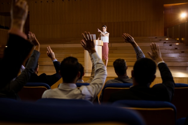 Female business executive giving a speech