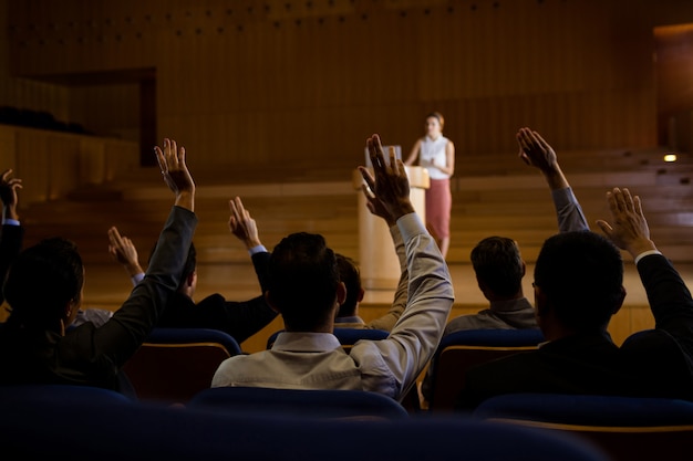 Female business executive giving a speech