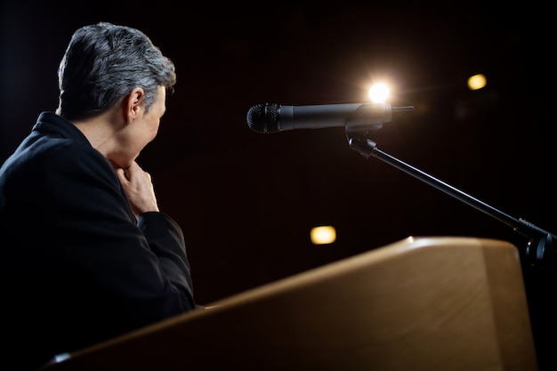 Female business executive giving a speech