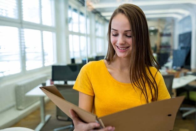 Female business executive reading a file