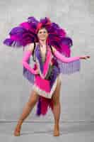 Free photo female cabaret performer posing in feathers costume