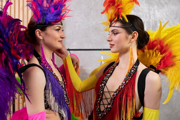 Female cabaret performers getting ready backstage together