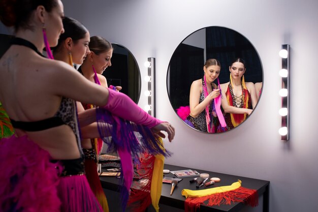 Female cabaret performers getting ready backstage