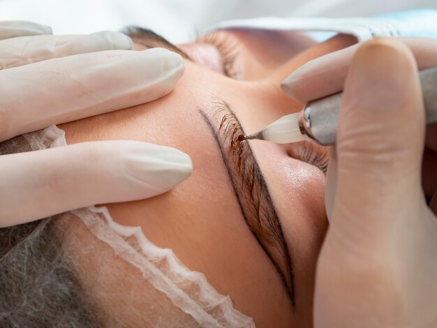female client going through a microblading treatment