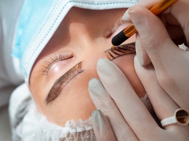 Female client going through a microblading treatment