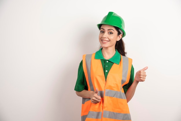 Female construction site engineer with helmet . High quality photo