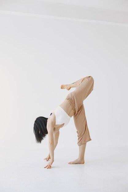 Female contemporary style ballet dancer. Woman in a dance studio.