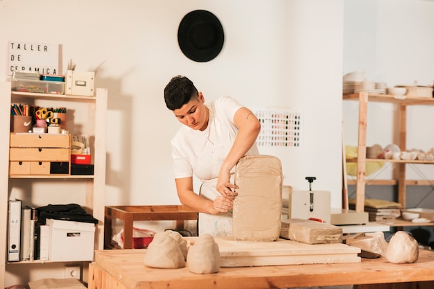 Female craftswoman opening the cover of in the workshop