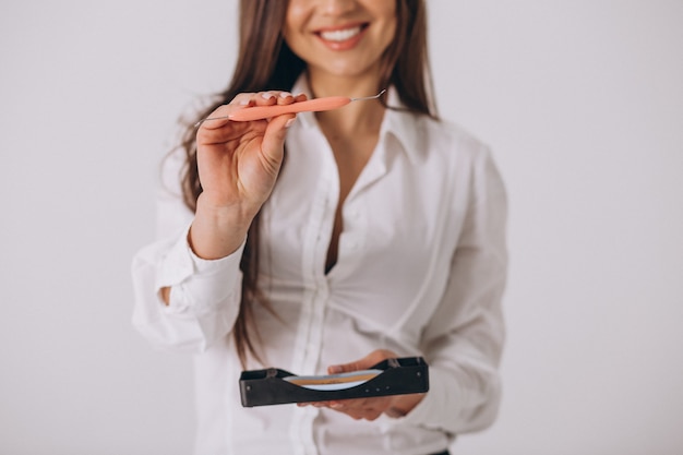 Female dentist with dentistry tools isolated