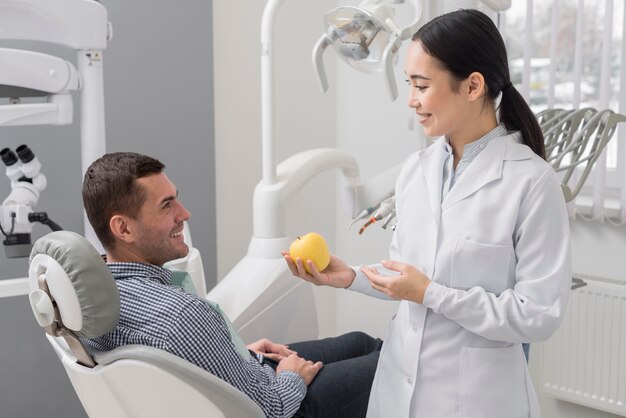 Female dentist with patient