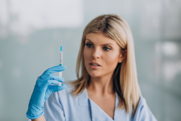 Female dermatologist with prick in hands