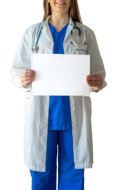 Female doctor in a blue medical uniform holding a blank white paper with a copy space horizontally