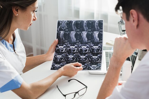 Female doctor explaining a radiography to patient