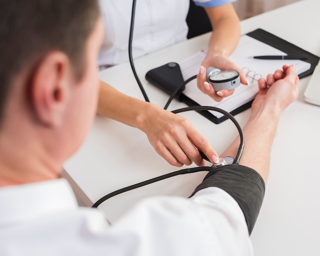 Female doctor hands checking patient