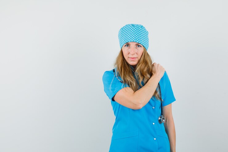 Free Photo female doctor holding hand on shoulder pain in blue uniform 