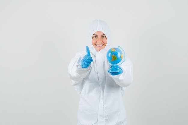 Female doctor holding world globe