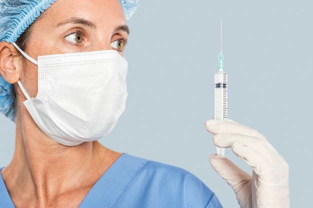 Female doctor png holding a syringe