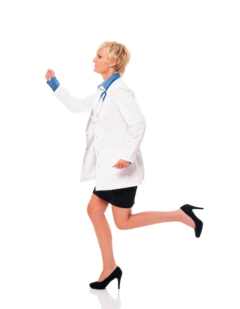 Free photo female doctor running for her patients