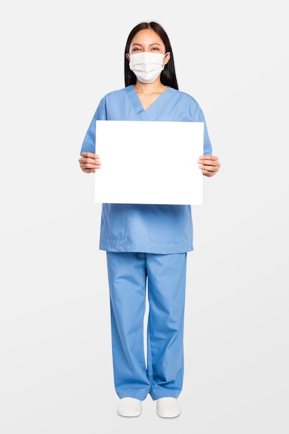 Female doctor showing a blank sign board