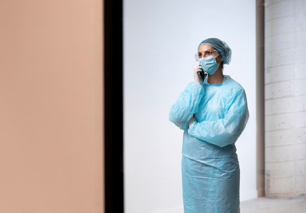 Female doctor talking on the phone with copy space