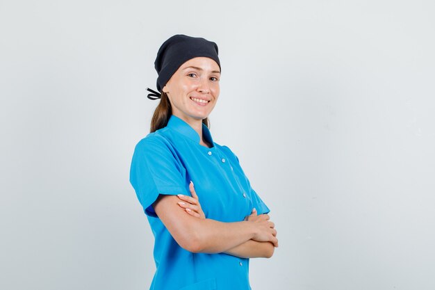 Female doctor in uniform crossing arms and smiling and looking confident