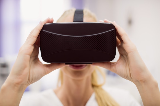 Female doctor wearing virtual reality headset