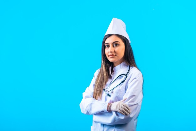 Female doctor with stethoscope looks professional.