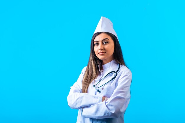 Female doctor with stethoscope looks professional. 