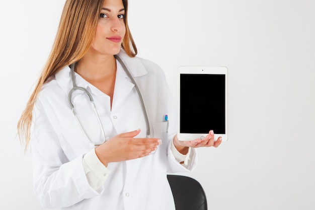 Female doctor with tablet