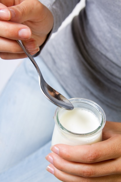 Female eating yogurt 