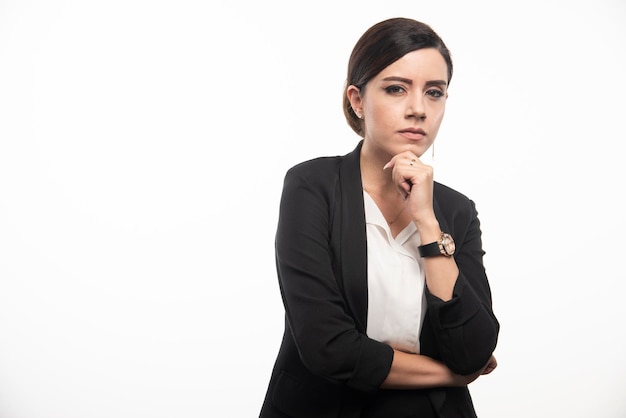 Female employee standing on white background. High quality photo