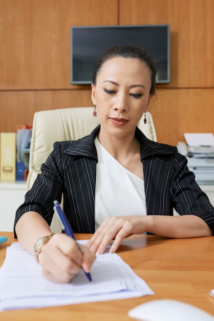 Female entrepreneur filling document