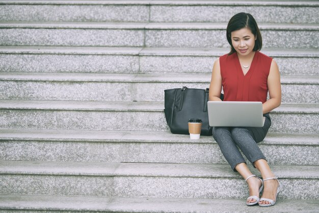 Female entrepreneur working on laptop