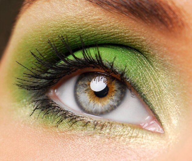 Female eyes with bright green color